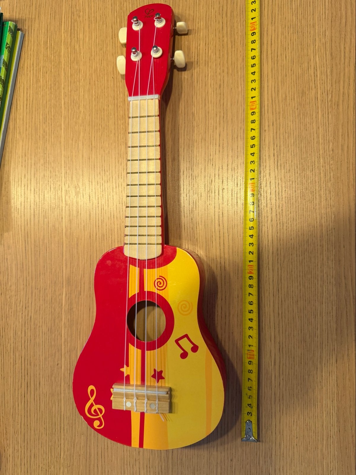 Hape houten ukele/gitaar rood/geel, Ophalen of Verzenden, Gebruikt, Jongen of Meisje