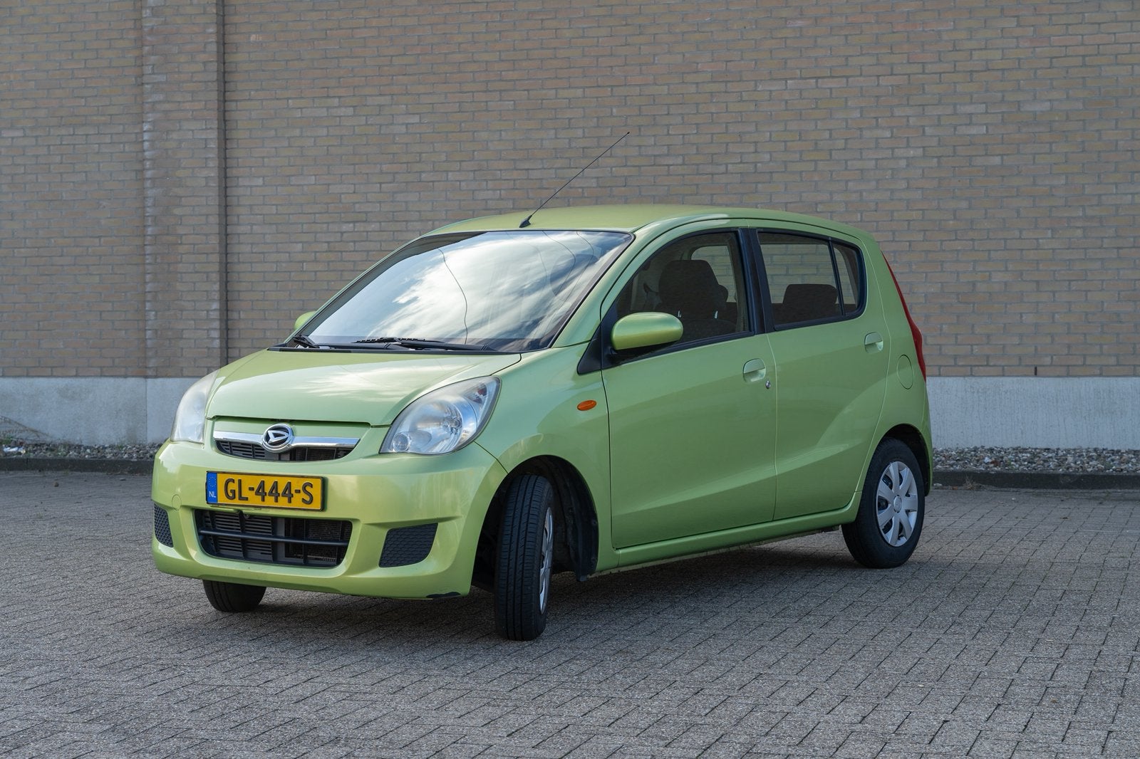 Daihatsu Cuore 1.0 5D AUT 2011 Groen, Auto's, Stof, 600 kg, Zwart, 18 €/maand