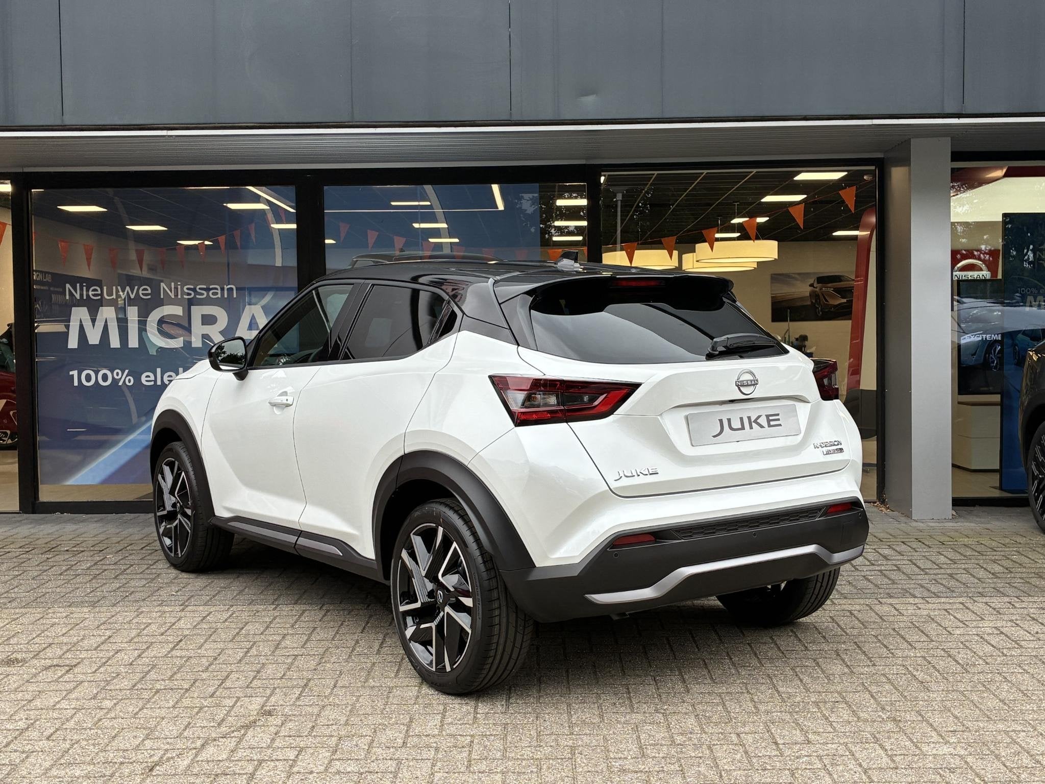 Nissan Juke 1.0 DIG-T N-Design NIEUW UIT VOORRAAD LEVERBAAR, Auto's, Stof, Met garantie (alle), Wit, Bedrijf