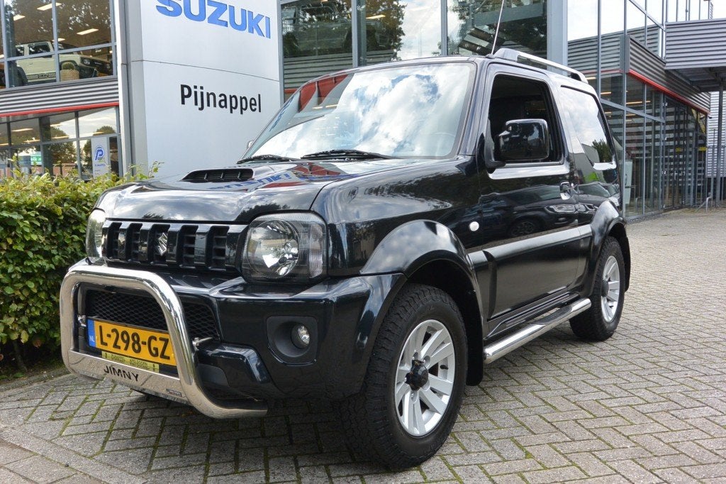 Suzuki JIMNY 1.3 Exclusive 4x4 Leder/Airco/Sidebars/Pushbar/, Auto's, Euro 5, 86 pk, Met garantie (alle), 4 stoelen