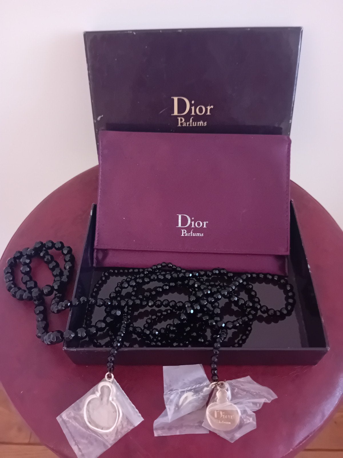 Dior Parfums Ketting, Zwart, Ophalen of Verzenden, Zo goed als nieuw, Overige materialen