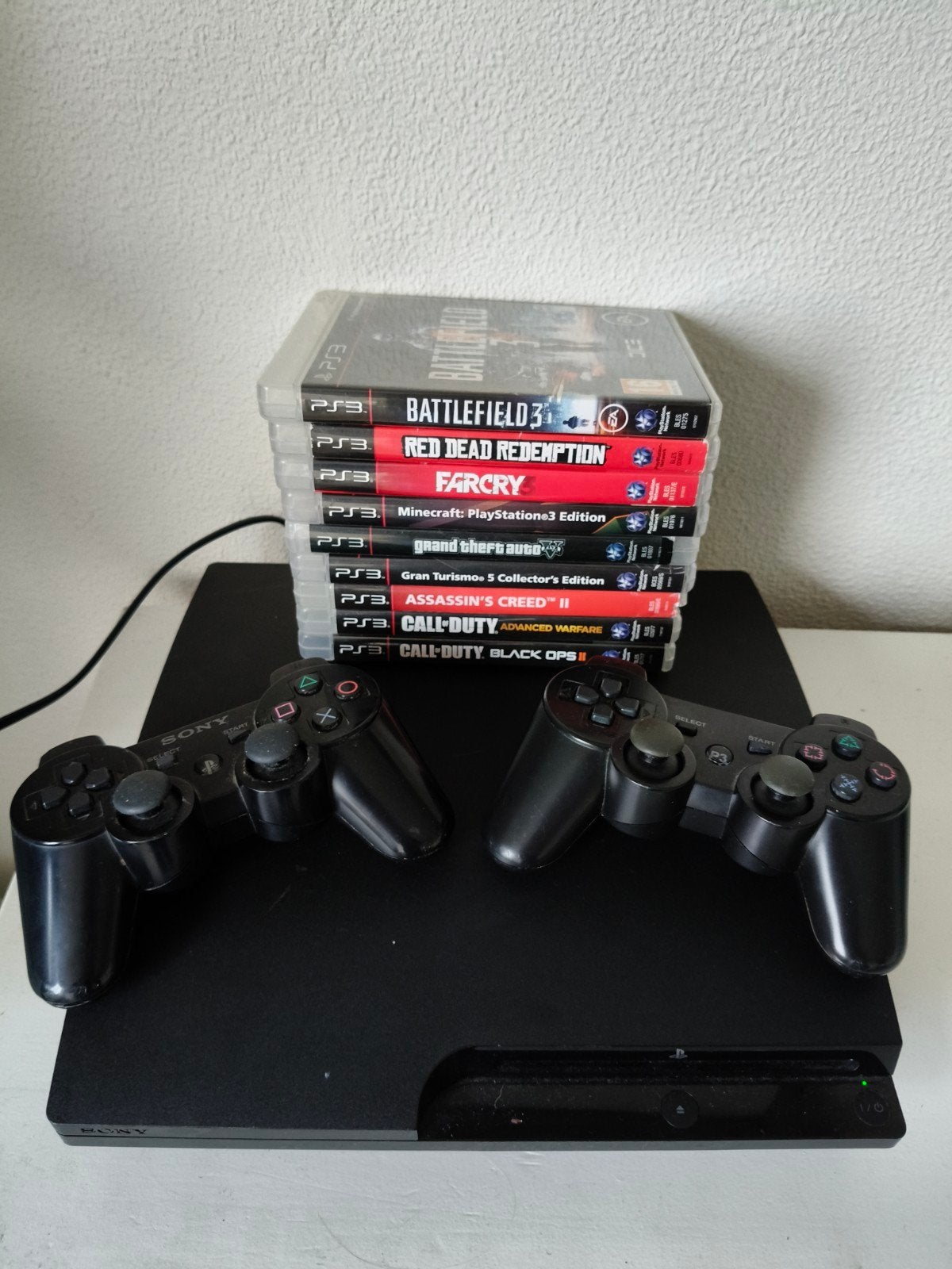 PlayStation 3 Slim CECH-3004A met 2 controllers en games, Spelcomputers en Games, Met 2 controllers, Slim, Gebruikt, Met games