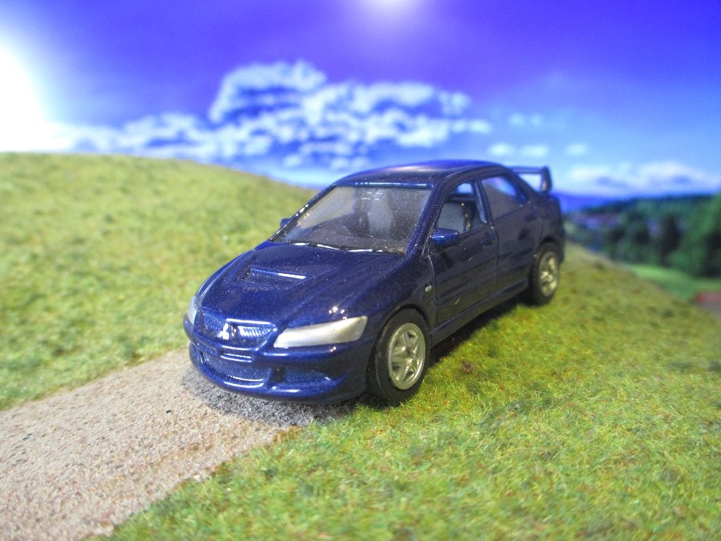 1:64 Mitsubishi Lancer Evo VIII - Welly, Ophalen of Verzenden, Zo goed als nieuw, Auto