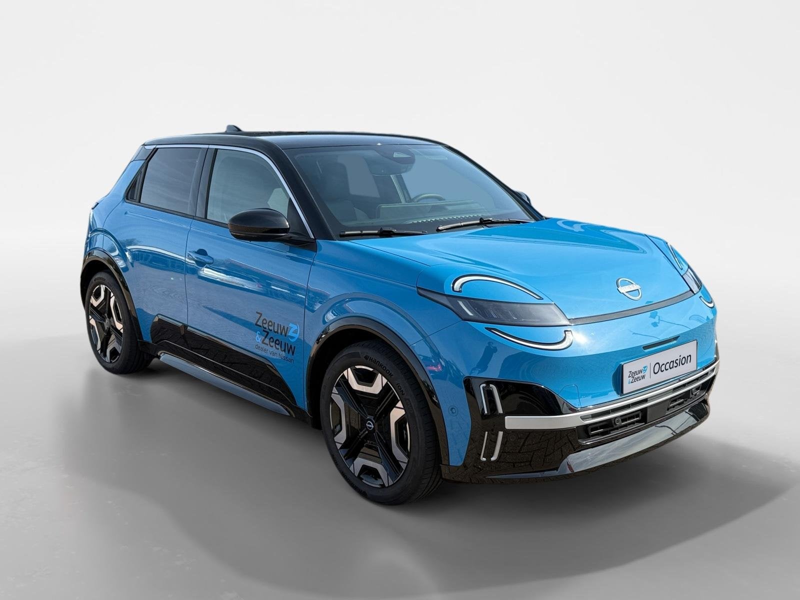 Nissan Micra EVOLVE 52 kWh *Navi+Camera*Winter Pack*Harman K, 150 pk, Blauw, Leder en Stof, Origineel Nederlands