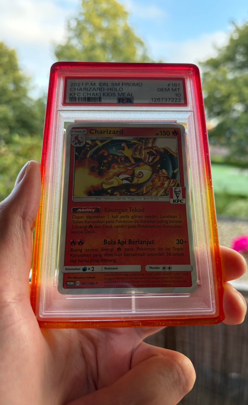 Charizard KFC - IDN - promo - 181/SM-P - PSA 10 - pop 1000, Hobby en Vrije tijd, Verzamelkaartspellen | Pokémon, Ophalen of Verzenden