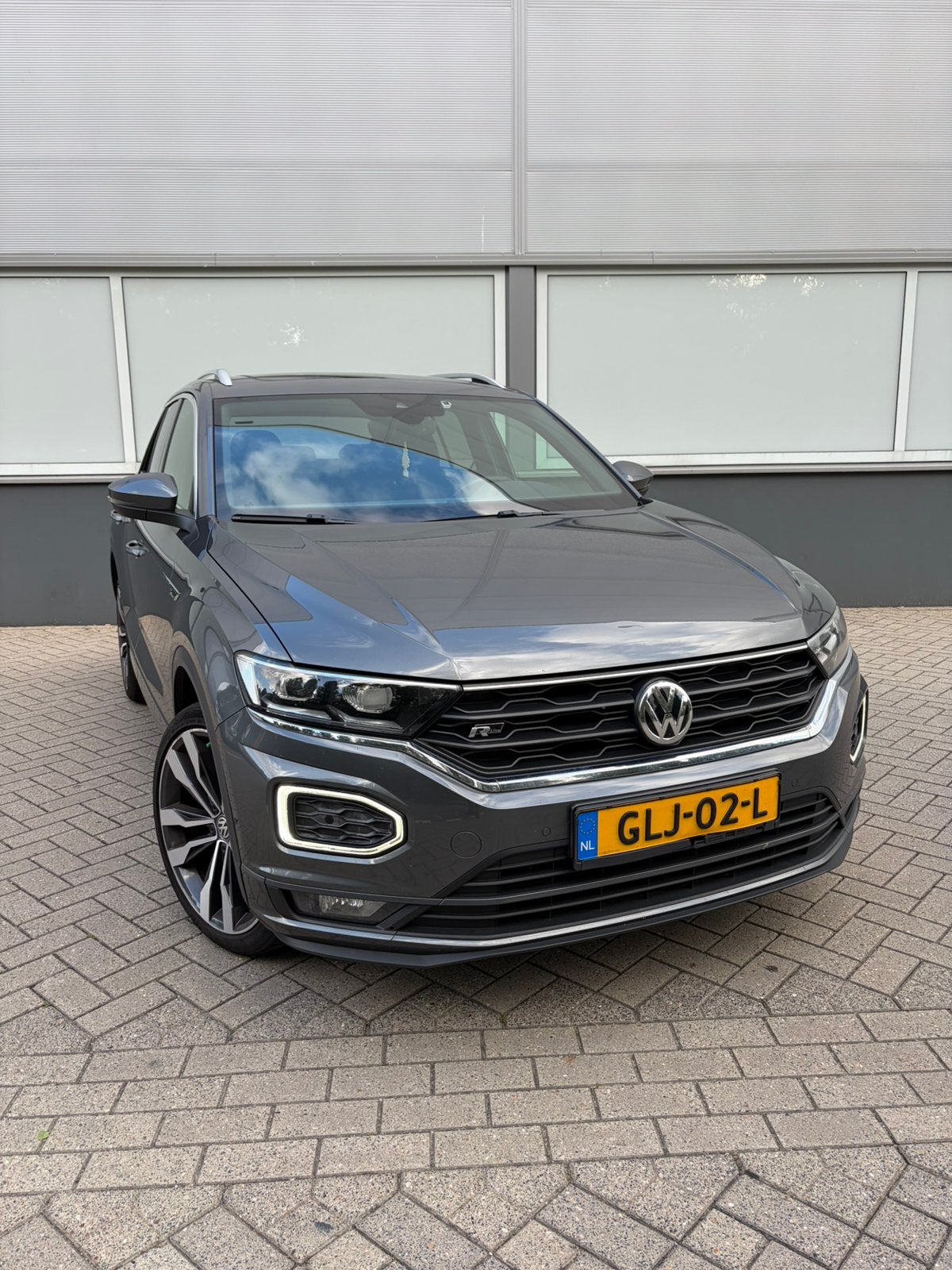 Volkswagen T-Roc 2.0 TSI 190pk 4Motion 7-DSG 2020 Grijs, Auto's, Automaat, Stof, 1984 cc, Parkeerassistent