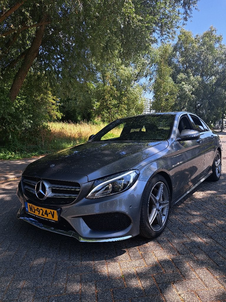 Mercedes-Benz C-Klasse C180 AMG Line 1.6, Auto's, Automaat, 1800 kg, Zwart, Particulier