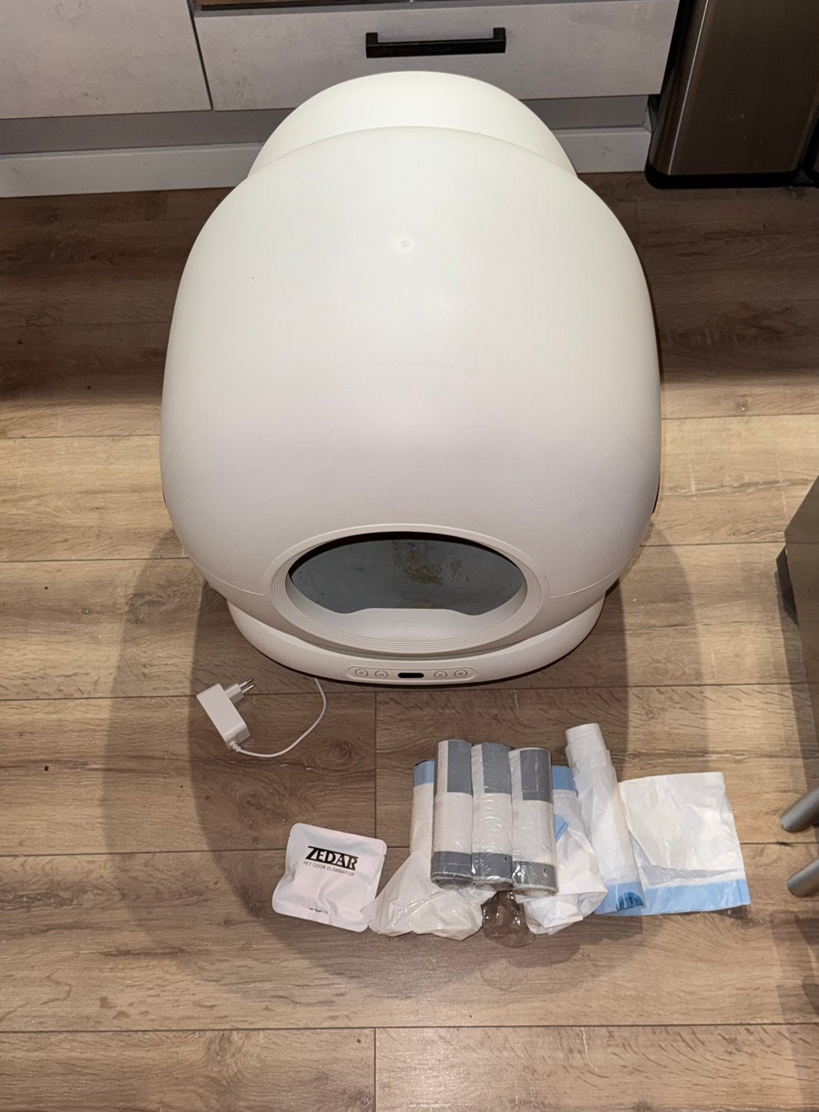 Zedar kattenbak K1200, Ophalen