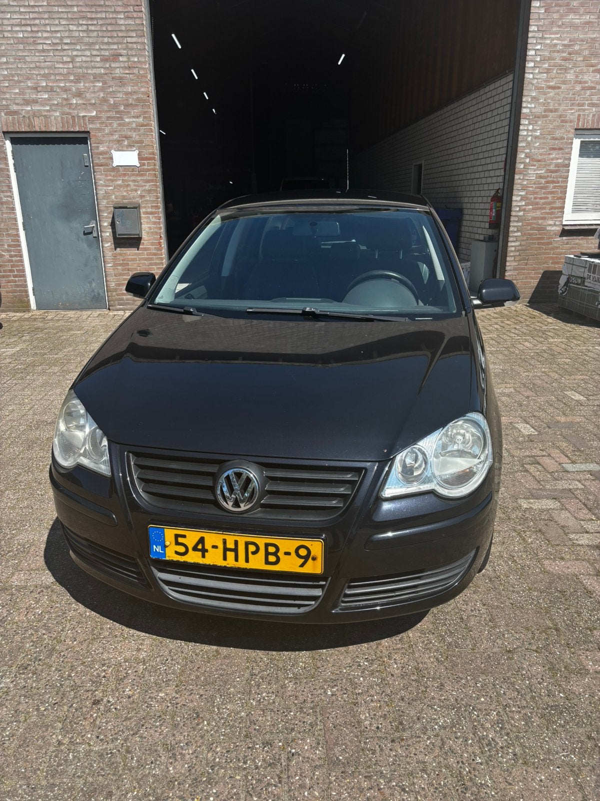 Volkswagen Polo 1.4 16V 59KW 2009 Zwart, Auto's, Volkswagen, Voorwielaandrijving, 40 €/maand, 4 cilinders, Zwart
