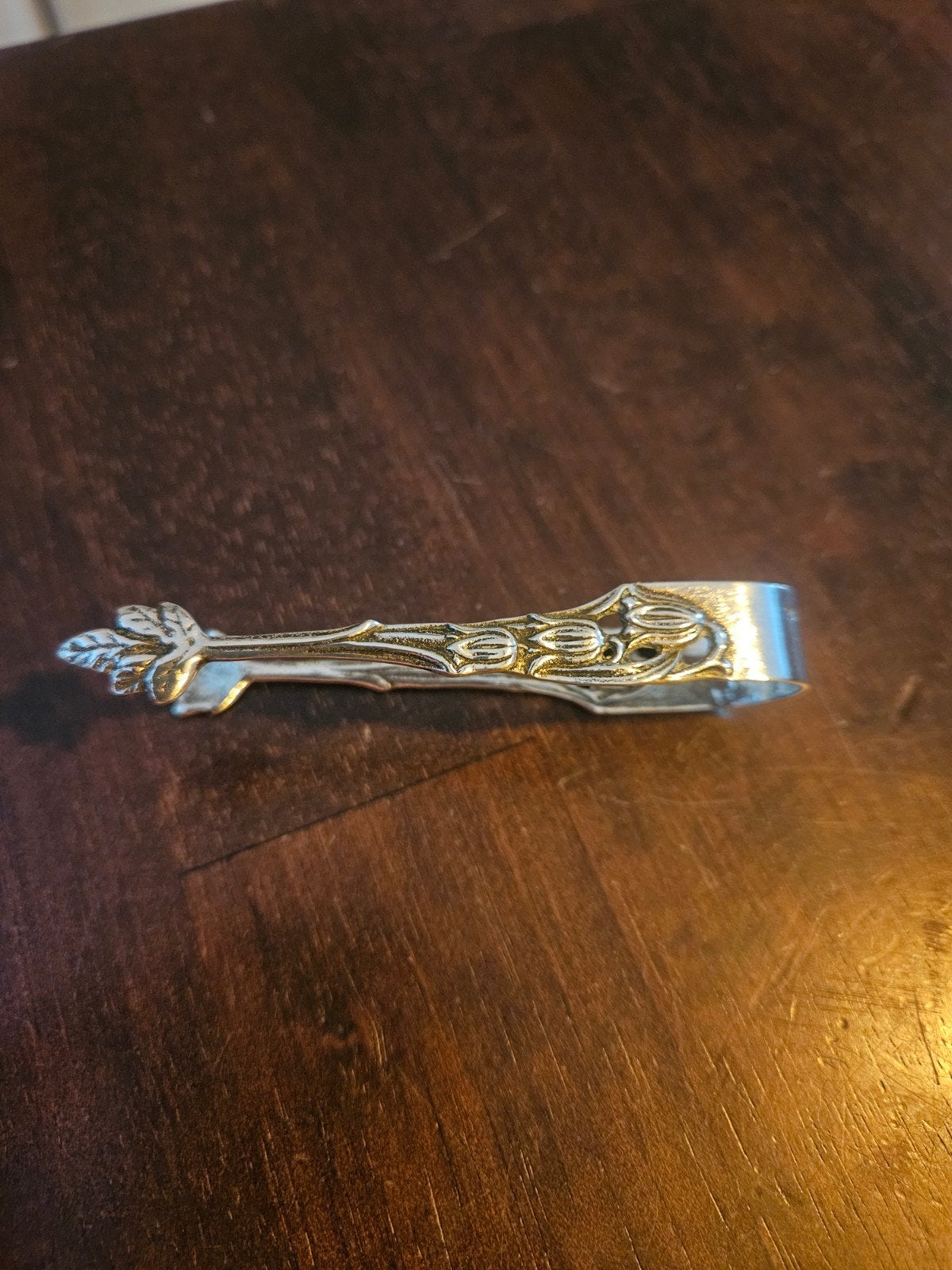 Antieke zilveren suikertang met bladmotief, Antiek en Kunst, Ophalen of Verzenden, Zilver