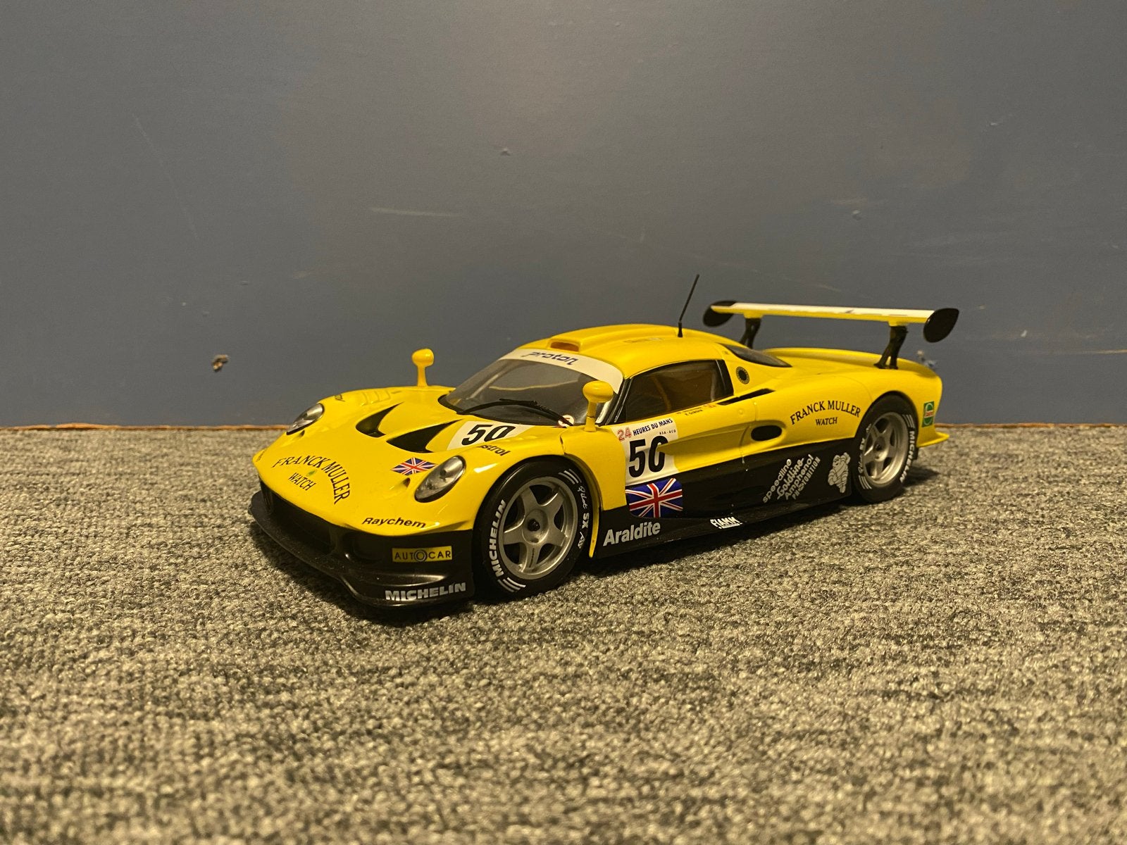 Lotus GT1 Franck Muller Chrono 1:18 Geel/Zwart, Ophalen of Verzenden, Zo goed als nieuw, Auto, Overige merken