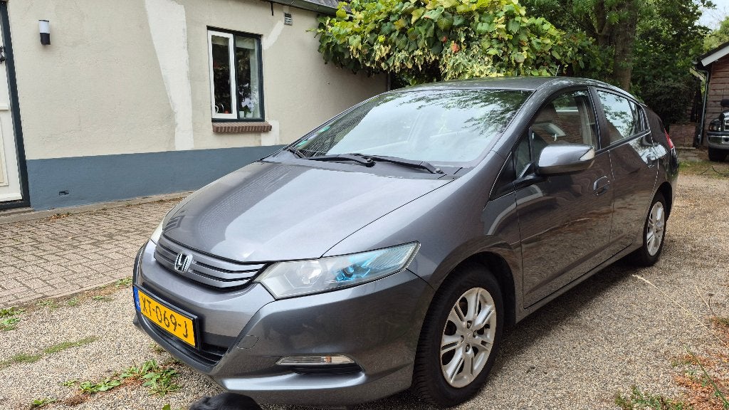 Honda Insight 1.3 Hybrid AUT 2010 Grijs, Auto's, Dealer onderhouden, Stof, Beige, 23 km/l