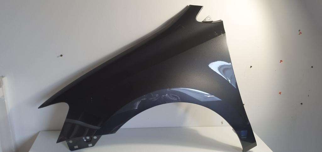 Spatbord Polo 1.6 TDI 2012 links, Ophalen, Voor, Volkswagen, Spatbord