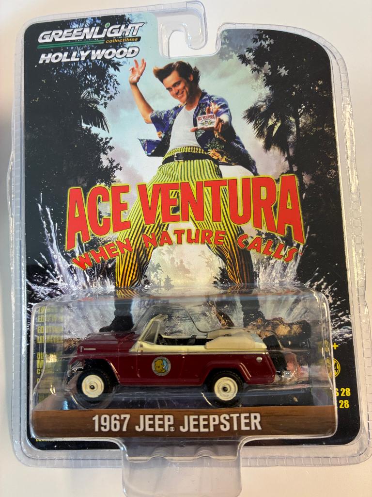 89386: Jeep Jeepster - Ace Ventura - 1967 - Greenlight 1:64, Auto, Nieuw, Ophalen of Verzenden, Bachsatztstr. 54 D 72131 Ofterdingen, Germany