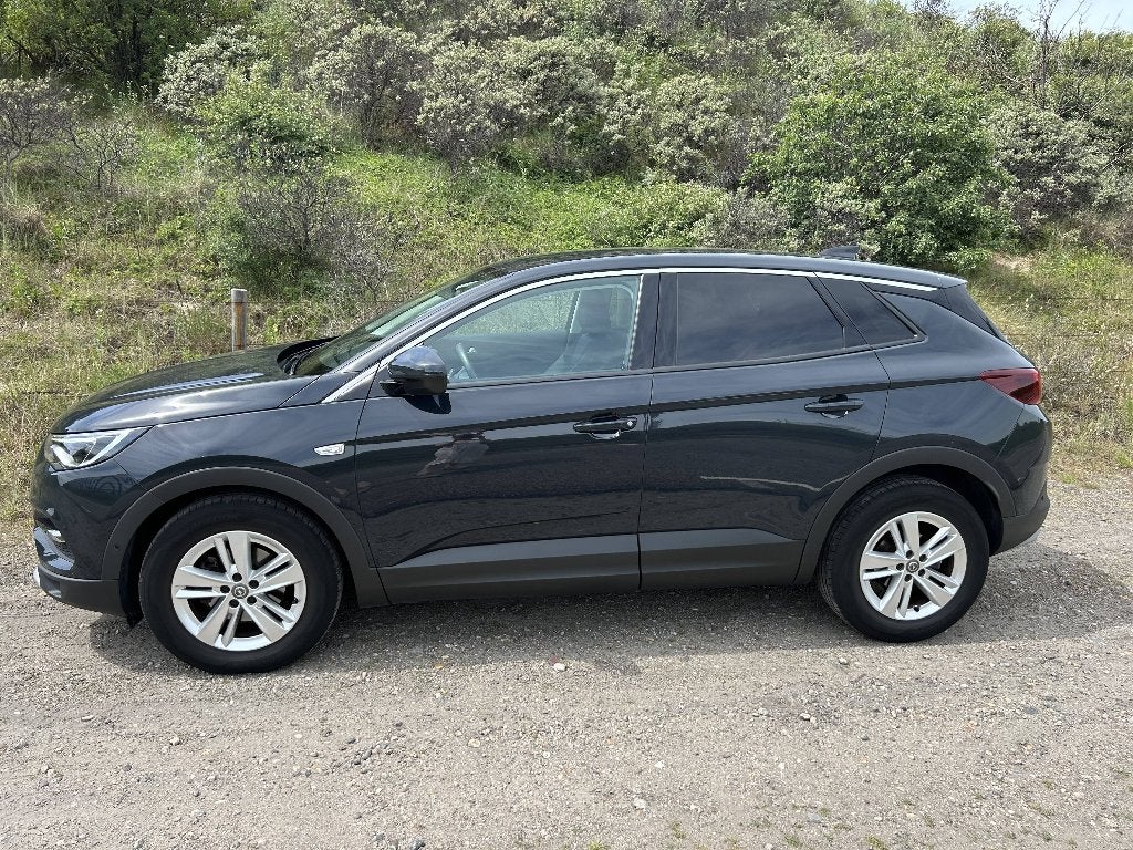 Opel Grandland X 1.2 Turbo Business Executive 2018 130 pk, Auto's, Voorwielaandrijving, Zwart, 1199 cc, Leder en Stof