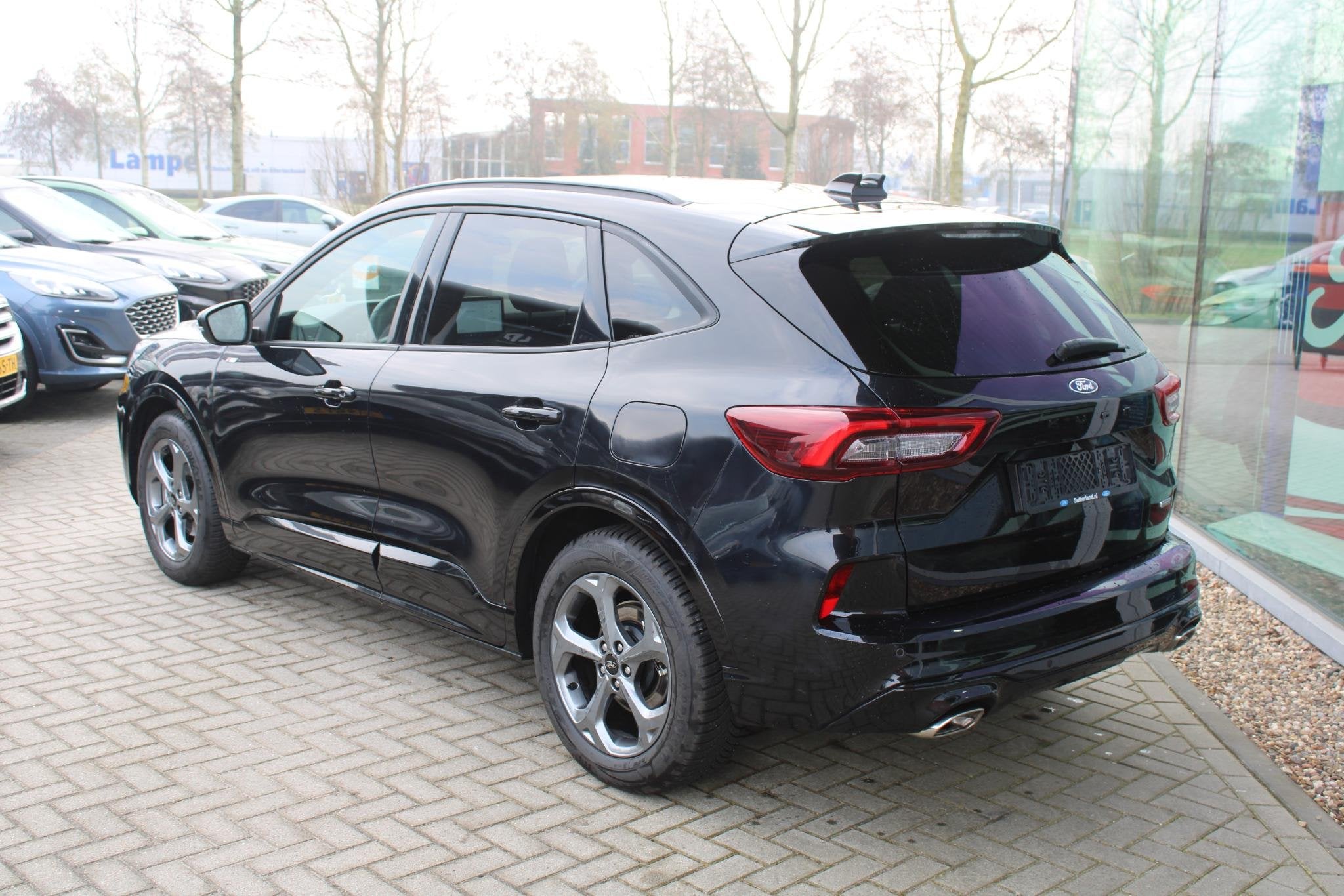 Ford Kuga 2.5 FHEV ST-Line 190pk | Winterpack | Achteruitrij, Stof, Gebruikt, 1589 kg, Zwart