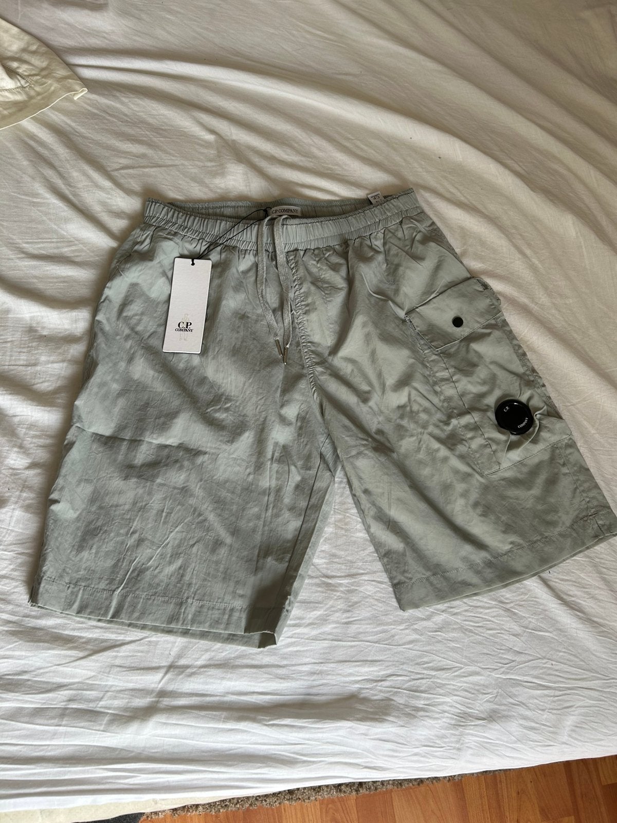 Nieuwe C.P Company zwem/cargo broek (maat M), Kleding | Heren, Ophalen of Verzenden, Nieuw, Maat 48/50 (M), Grijs