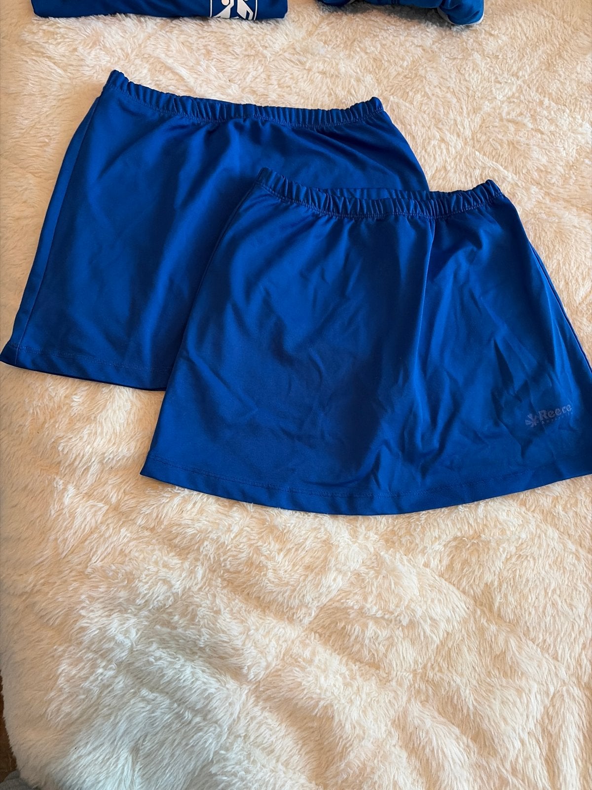 2 blauwe sportrokjes van Reece, maat 152, Blauw, Ophalen of Verzenden, Zo goed als nieuw, Maat 36 (S)
