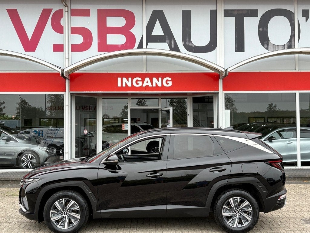 Hyundai TUCSON 1.6 T-GDI HYBRID 230PK AUT. LED NAVI CAMERA C, Auto's, Hyundai, Gebruikt, Huisgarantie, Met garantie (alle), Zwart