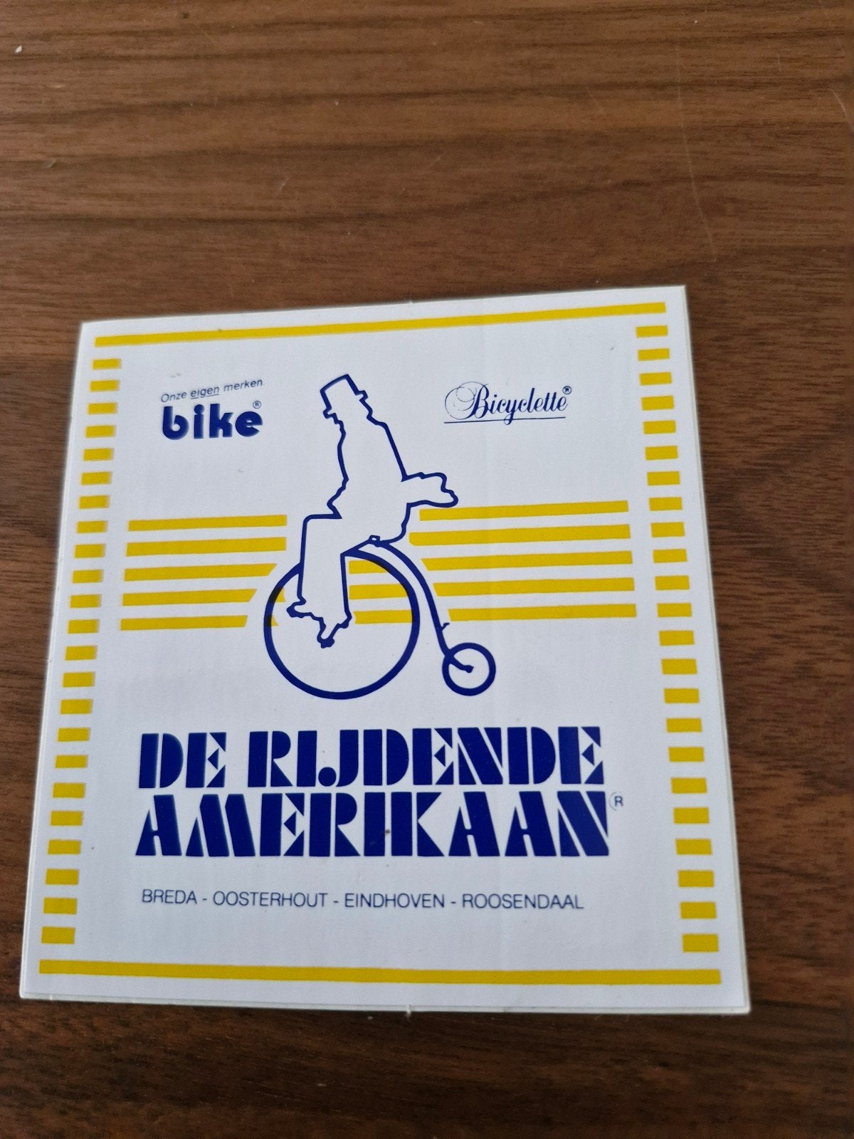 11972 Vintage 'De Rijdende Amerikaan' fietssticker, Ophalen of Verzenden, Zo goed als nieuw