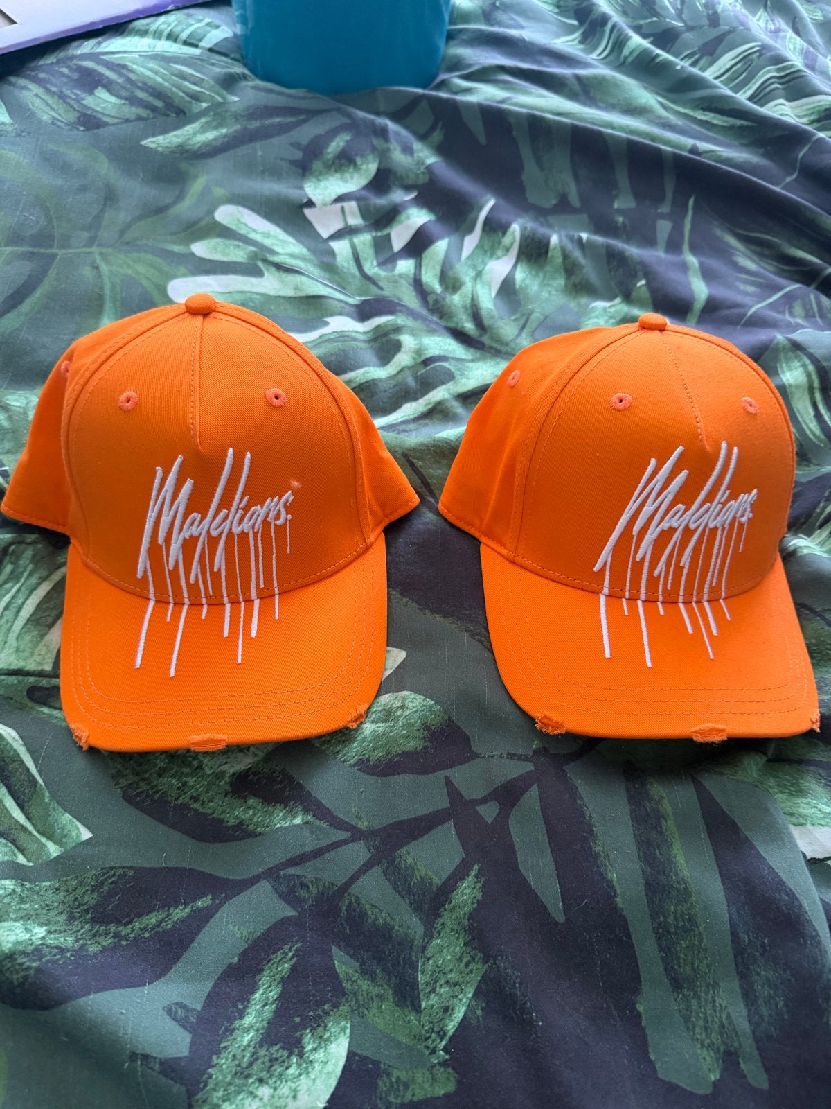 2x Oranje 'Malidians' Petten - nieuw, Kleding | Dames, Hoeden en Petten, Ophalen of Verzenden, Zo goed als nieuw, One size fits all