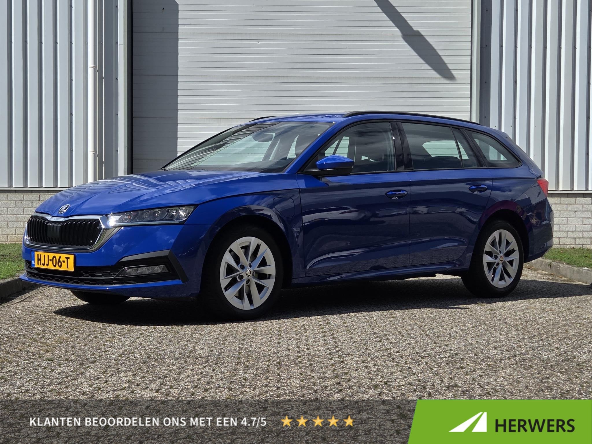 Skoda Octavia Combi 1.4 TSI iV PHEV Business Edition / Trekh, Auto's, Stof, Gebruikt, 4 cilinders, Blauw