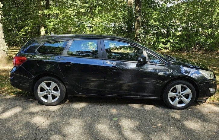 Opel Astra 1.4 Turbo 103KW ST 2011 Zwart, Auto's, Voorwielaandrijving, Stof, Zwart, 4 cilinders
