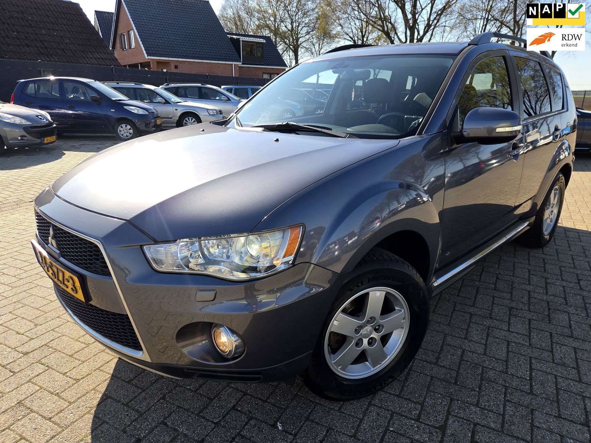 Mitsubishi Outlander 2.0 Edition One 2012. Airco/Cruise/Trek, Auto's, Mitsubishi, Zwart, 4 cilinders, Leder en Stof, Bedrijf