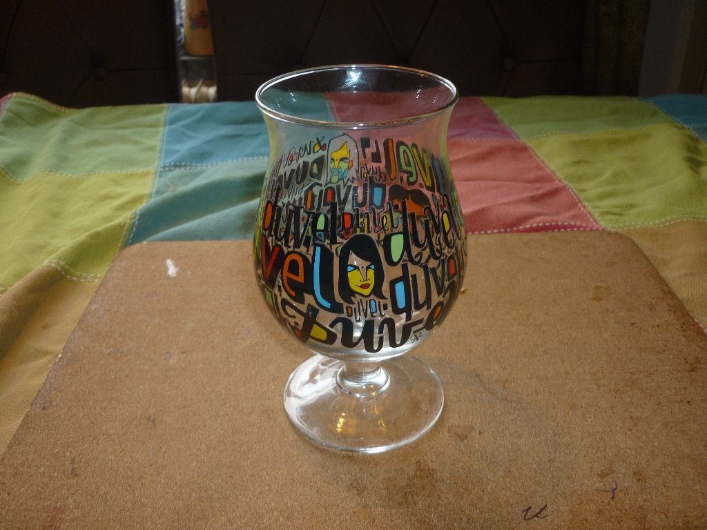 Mooie Duvel bierglas Denis Meyers in zeer goede staat, Ophalen of Verzenden, Zo goed als nieuw, Glas of Glazen, Duvel