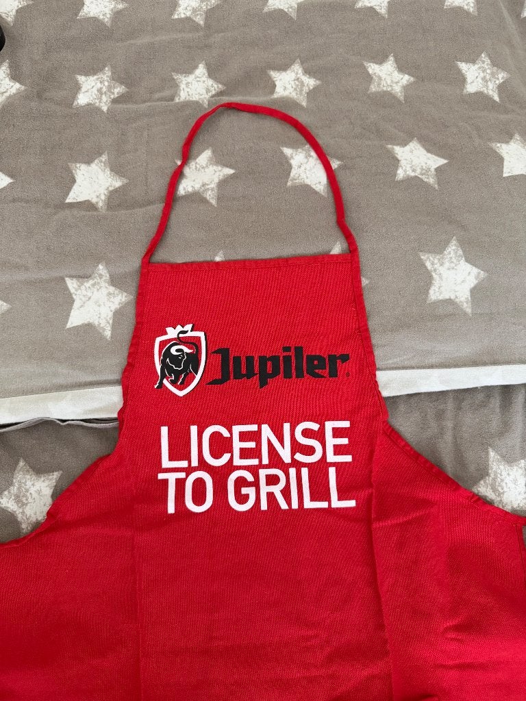 Jupiler keukenschort 'License to Grill', Ophalen of Verzenden, Nieuw, Kleding, Jupiler