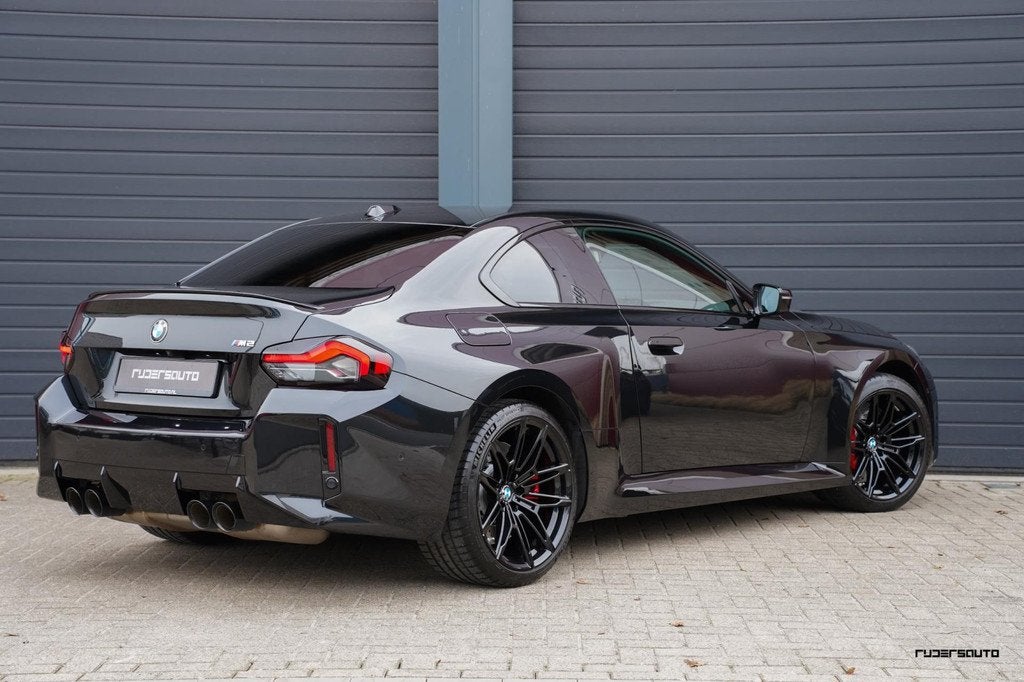 BMW M2 G87 | Handgeschakeld | Camera | HK | Sportstoelen + m, Auto's, BMW, Achterwielaandrijving, Zwart, Zwart, Leder