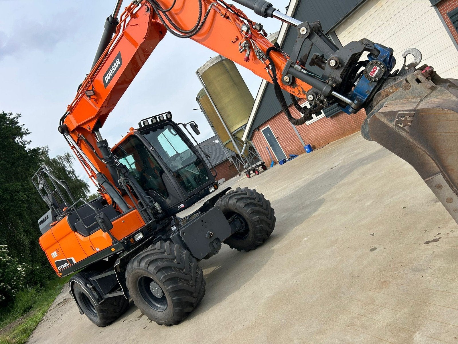 Doosan DX140W Graafmachine - Zeer Goede Staat, Zakelijke goederen, Machines en Bouw | Kranen en Graafmachines, Ophalen, Graafmachine