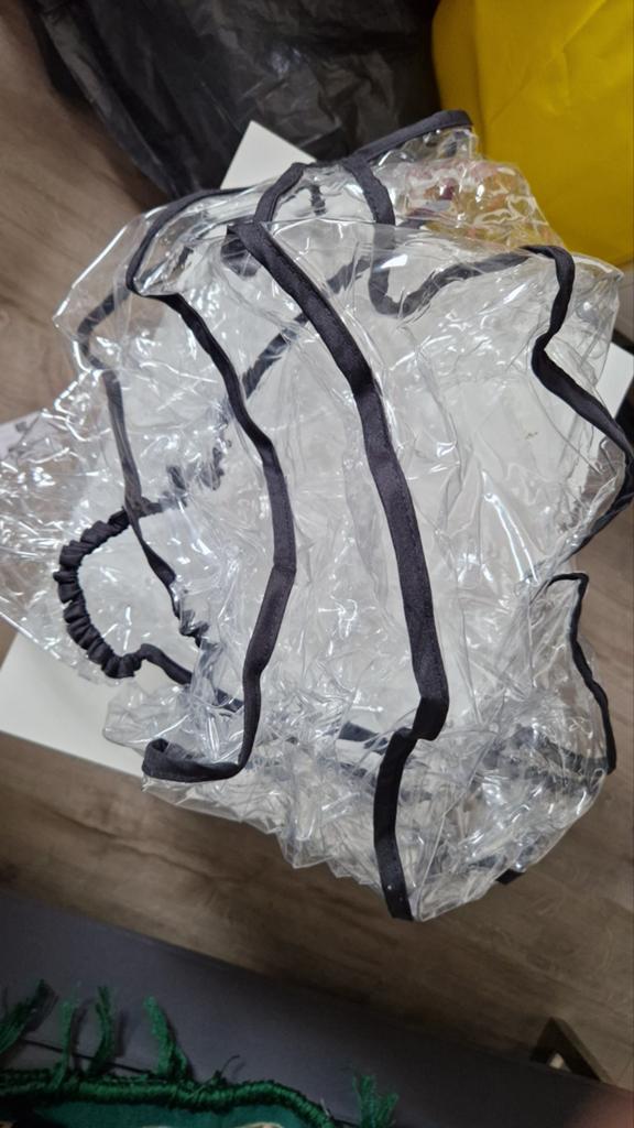 Regenhoes voor kinderwagen/buggy, Ophalen
