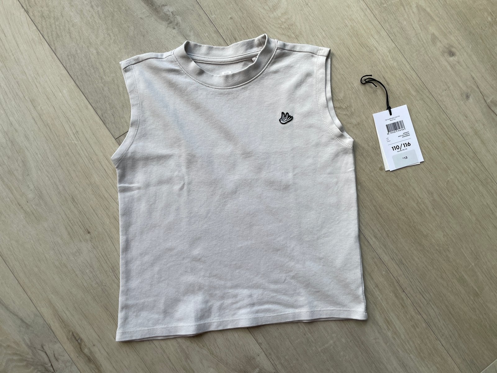WE Fashion singlet maat 110/116 – beige, Kinderen en Baby's, Kinderkleding | Maat 110, Ophalen of Verzenden, Zo goed als nieuw