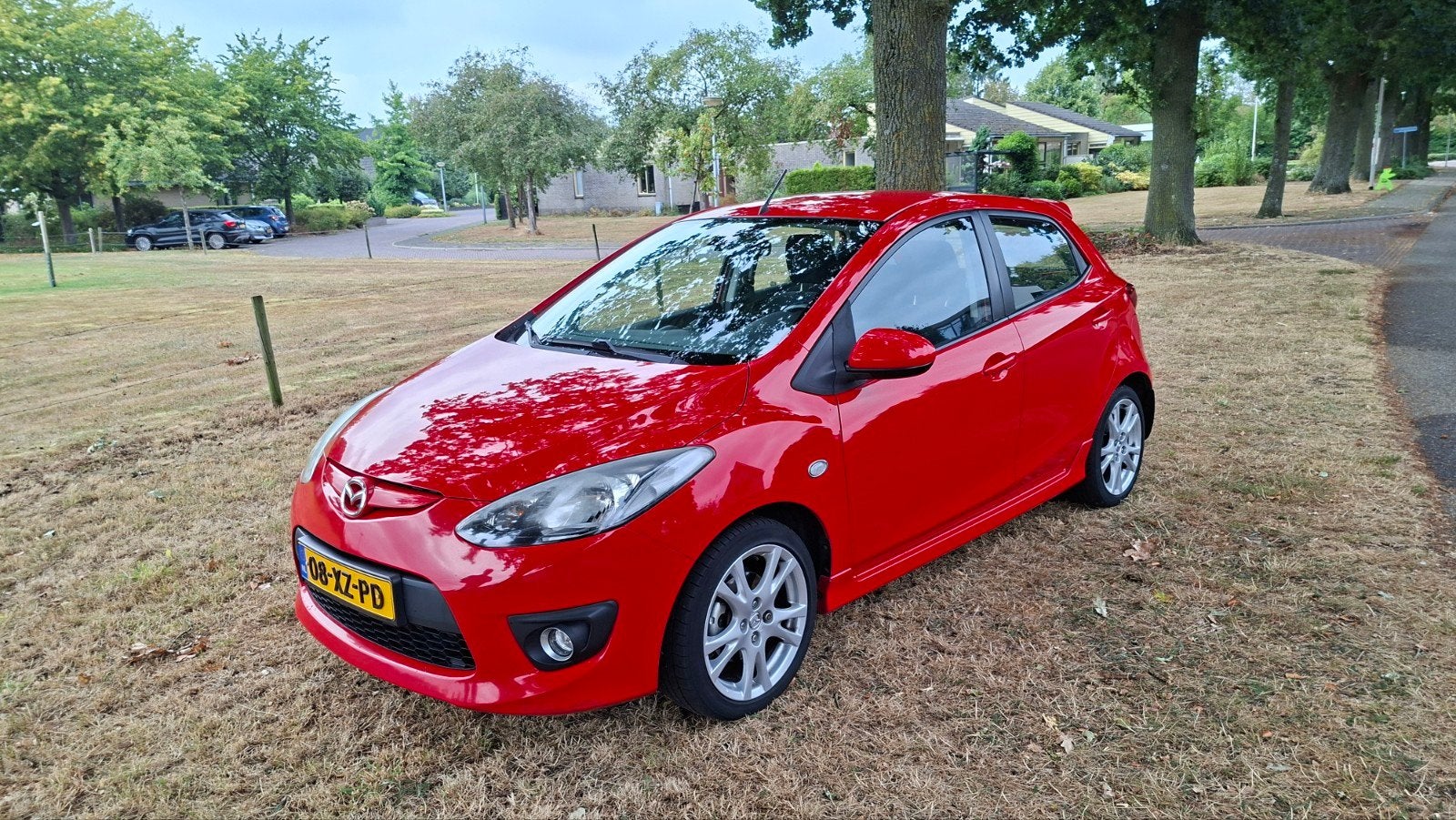 Mazda 2 1.5 76KW 5DRS 2007 Rood, Auto's, Voorwielaandrijving, Stof, 1498 cc, 4 cilinders