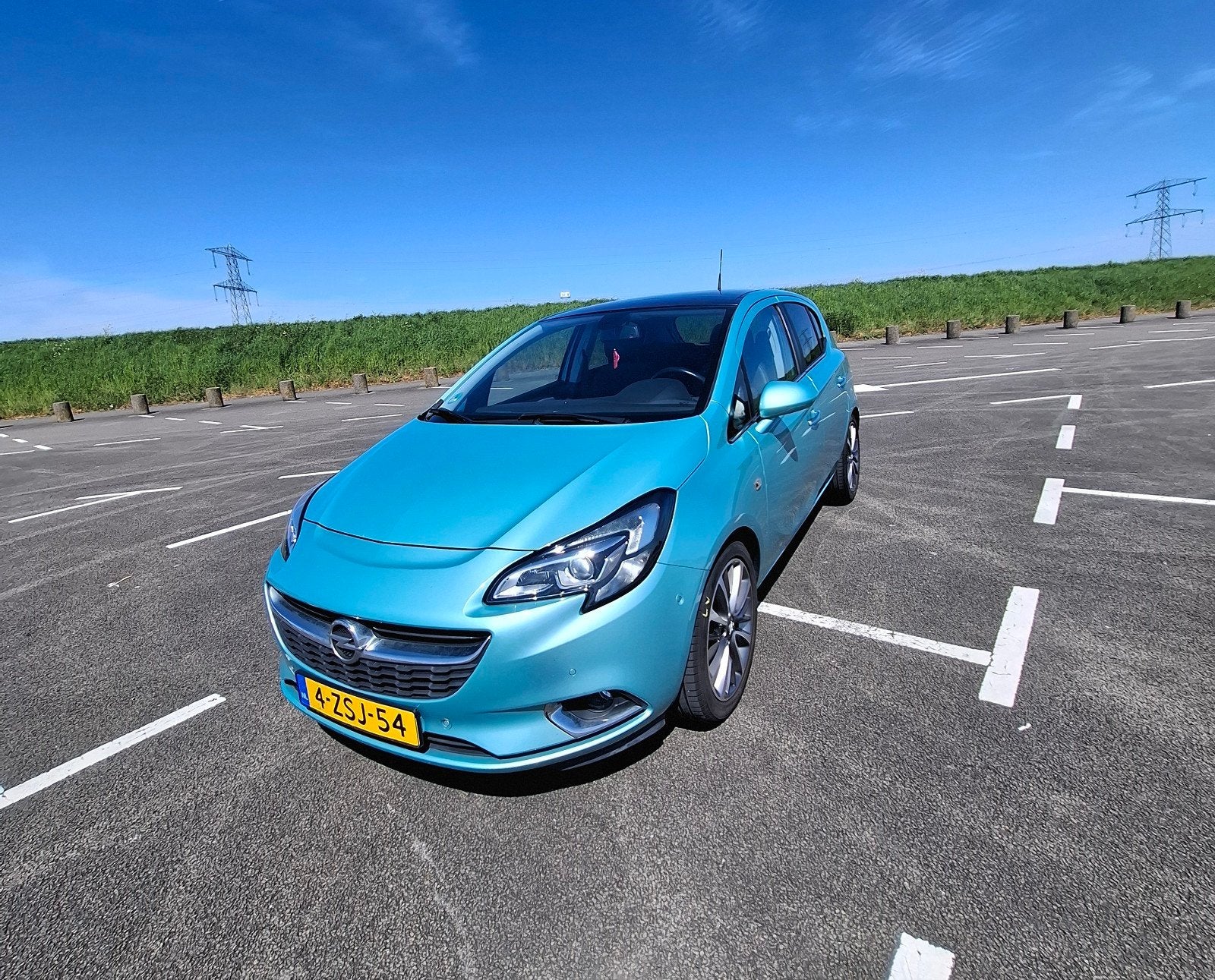 Opel Corsa 1.0T 85KW/115PK 5D 2015 Groen, Auto's, Voorwielaandrijving, Zwart, Leder en Stof, 49 €/maand