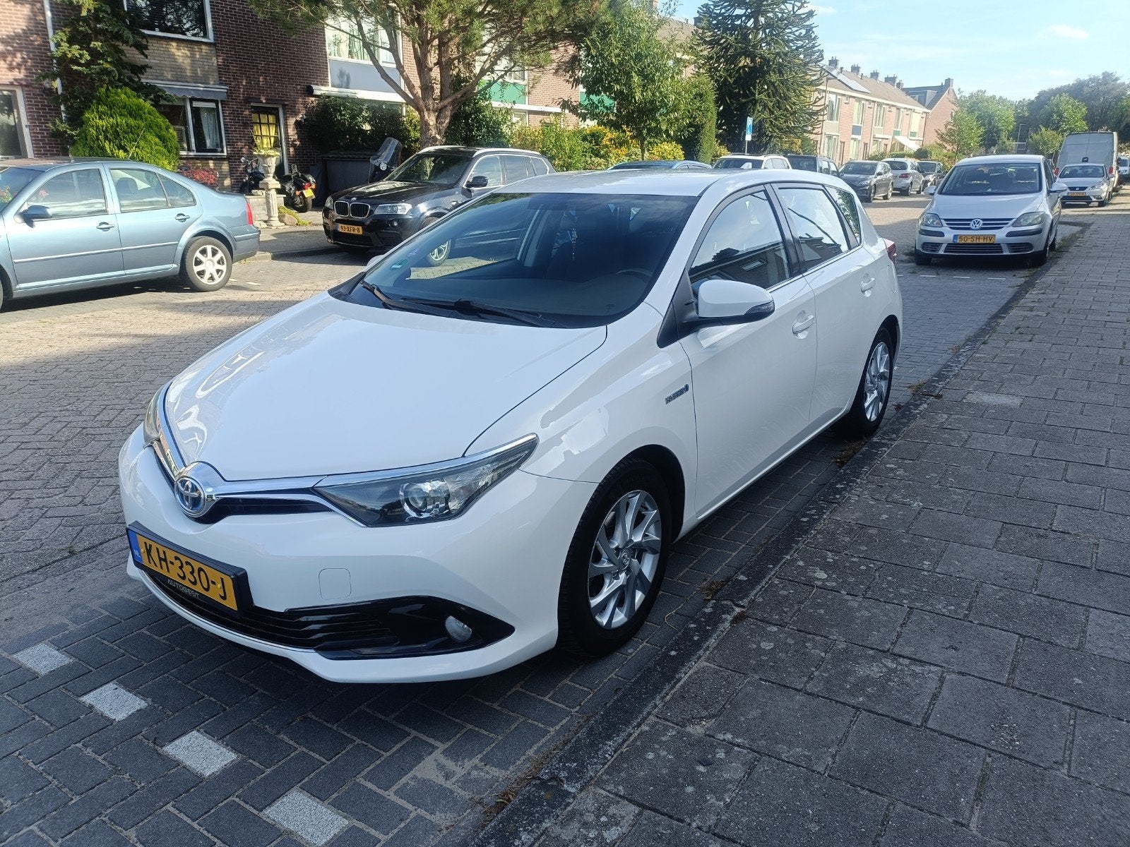 Toyota Auris 1.8 Hybrid 5DR CVT 2016 Wit 135.316km, 28 km/l, 4 cilinders, Wit, Origineel Nederlands