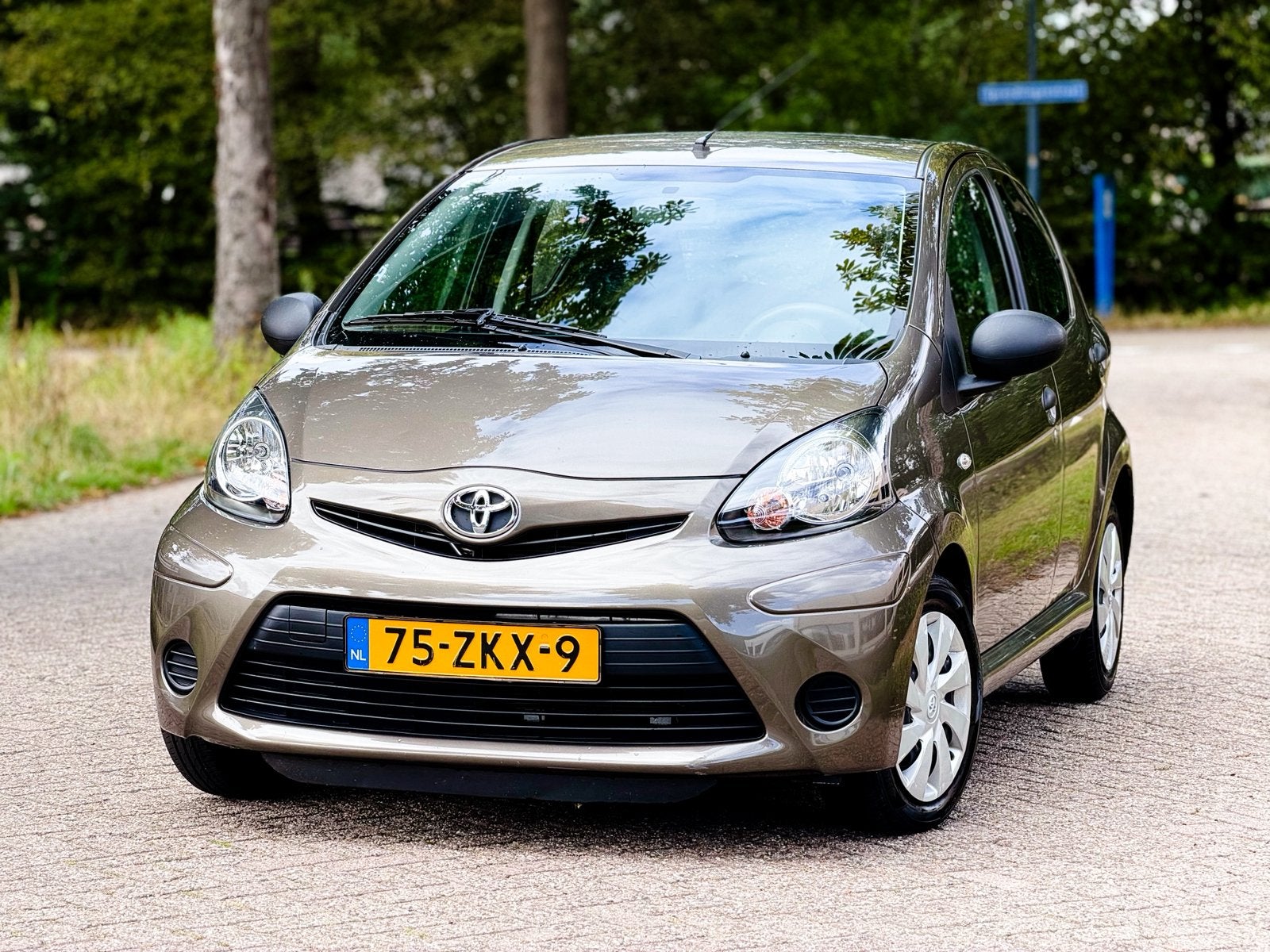 Toyota Aygo 1.0 12V Vvt-i 5DRS 2012 Bruin 43.465km 1e eigenr, Auto's, Voorwielaandrijving, Dealer onderhouden, Stof, Bruin