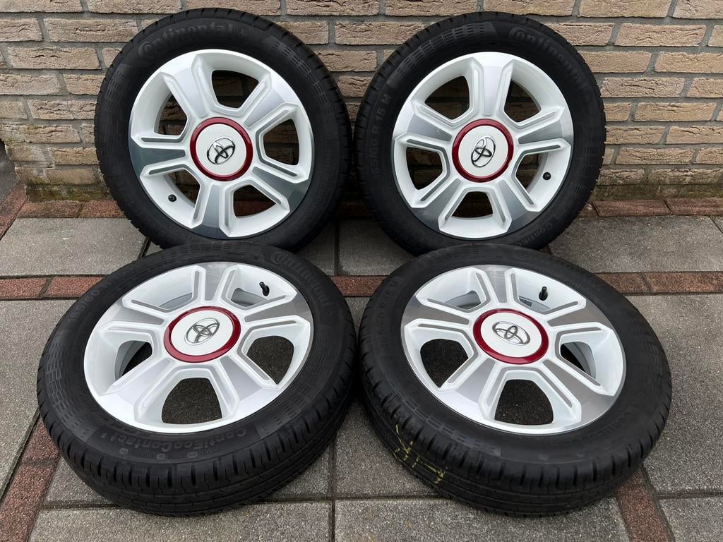 15 inch ORG Toyota aygo velgen met banden 4x100, Ophalen, 15 inch, Banden en Velgen, Winterbanden