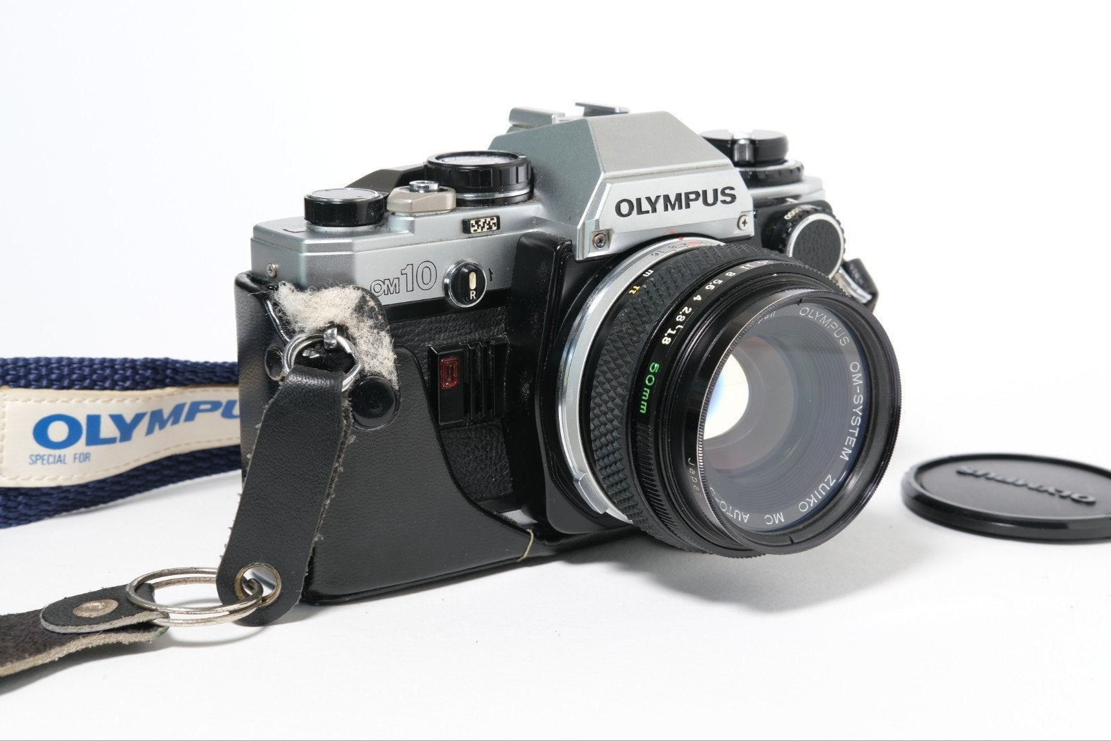 Olympus OM-10 met Manual Adapter en 50mm lens - Nieuwe Seals, Audio, Tv en Foto, Spiegelreflex, Onbekend, Ophalen of Verzenden