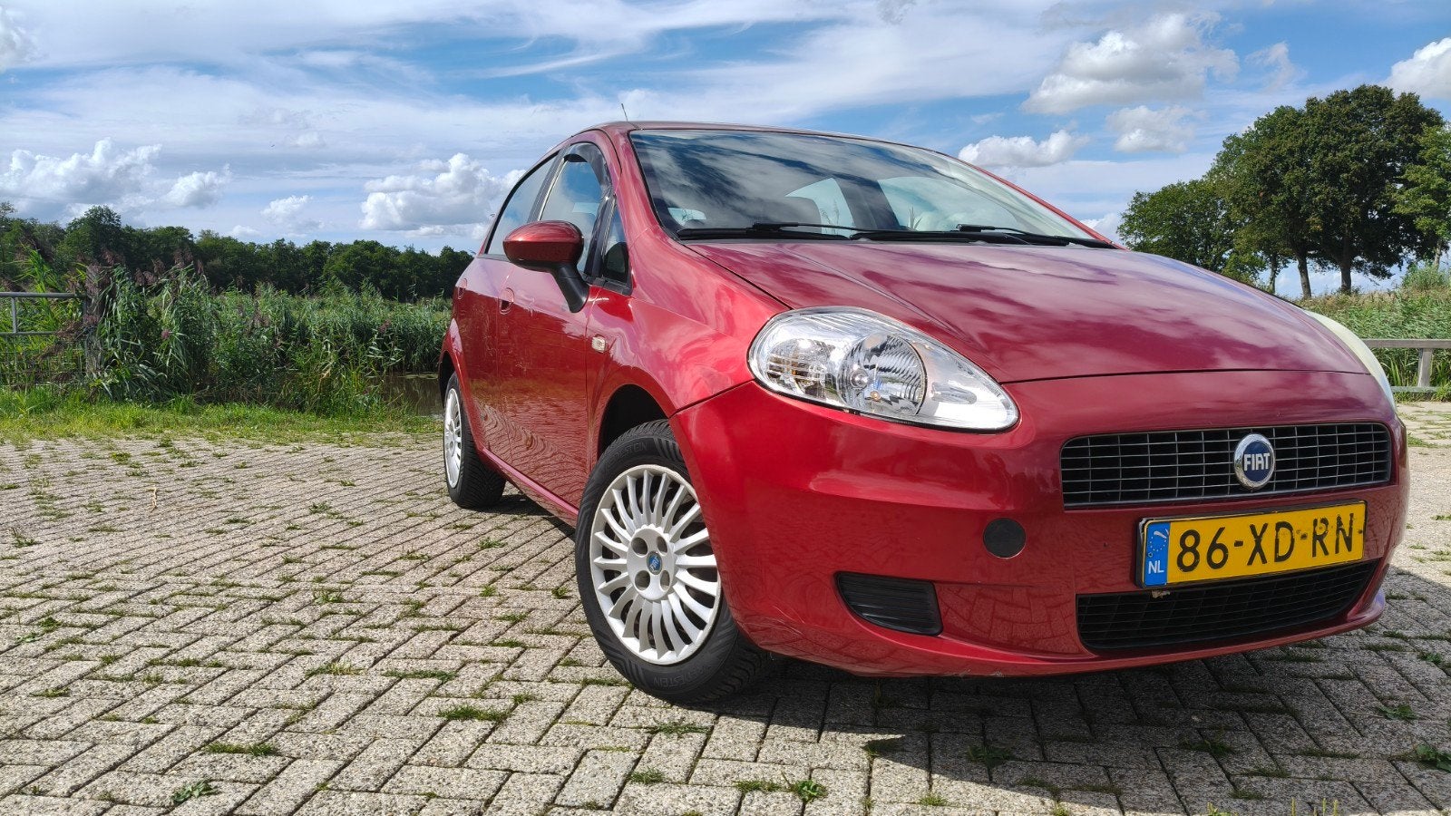 Fiat Grande Punto 1.4 8V Dual Logic Automaat trekhaak, Auto's, Stof, 40 €/maand, 4 cilinders, 400 kg