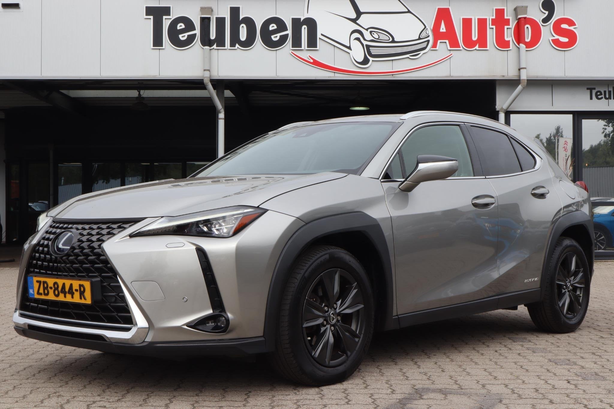 Lexus UX 250h F Sport First Edition | Achteruitrijcamera | 2, Auto's, Dealer onderhouden, Stof, Gebruikt, 4 cilinders