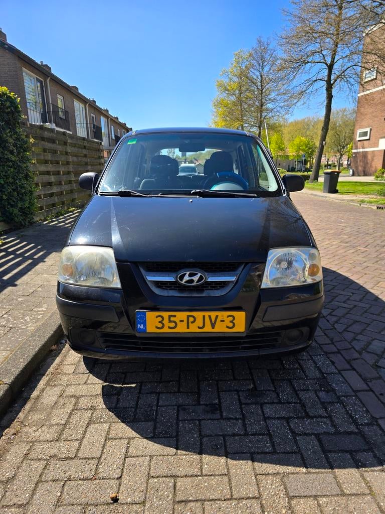 Hyundai Atos 1.1 2006 Zwart, Auto's, Voorwielaandrijving, Stof, 31 €/maand, 4 cilinders