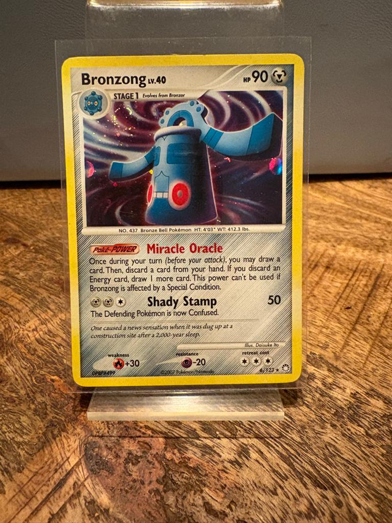 Bronzong Pokémon 6/123, Ophalen of Verzenden, Zo goed als nieuw, Losse kaart