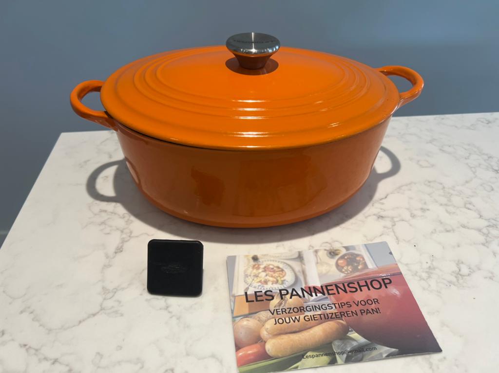 Vintage Le Creuset ovaal 27 cm, Harmonic Orange heel goed, Huis en Inrichting, Keuken | Potten en Pannen, Gebruikt, Gietijzer