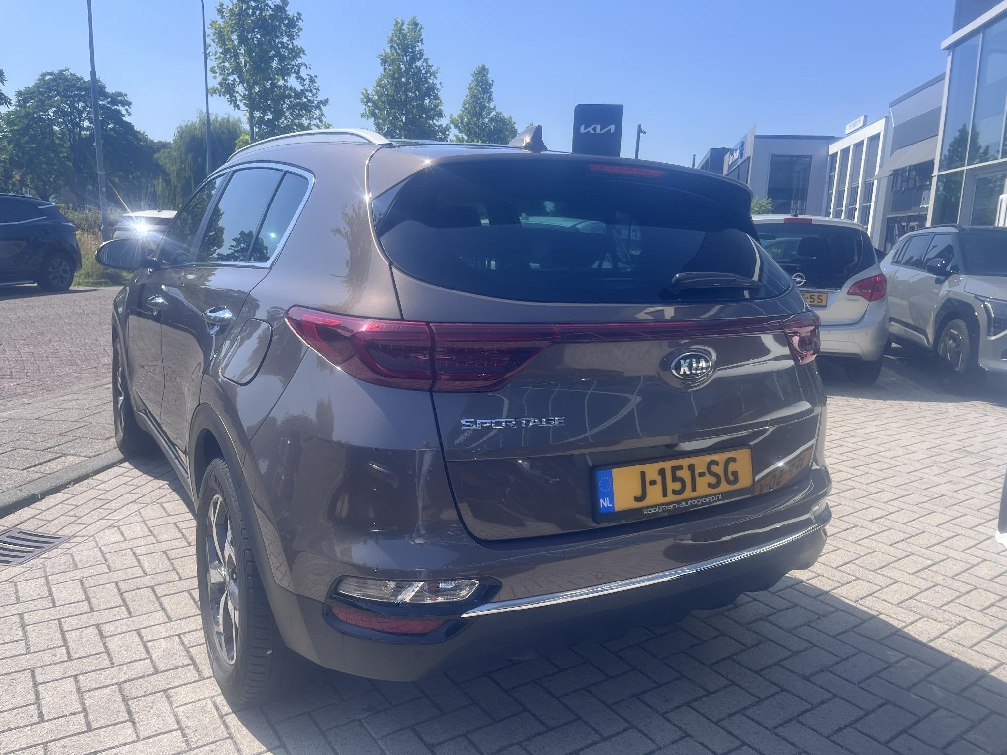 Kia Sportage 1.6 T-GDI DynamicLine Automaat|Nav|Camera|Lmv, Gebruikt, Bruin, Origineel Nederlands, 1600 kg