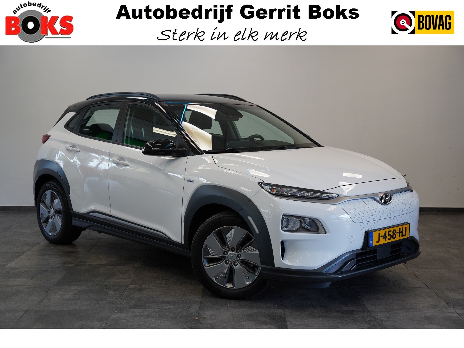 Hyundai KONA EV Comfort 64 kWh 3-Fase Warmtepomp Two-Tone Ad, Auto's, 12 maanden, Stof, Gebruikt, Zwart
