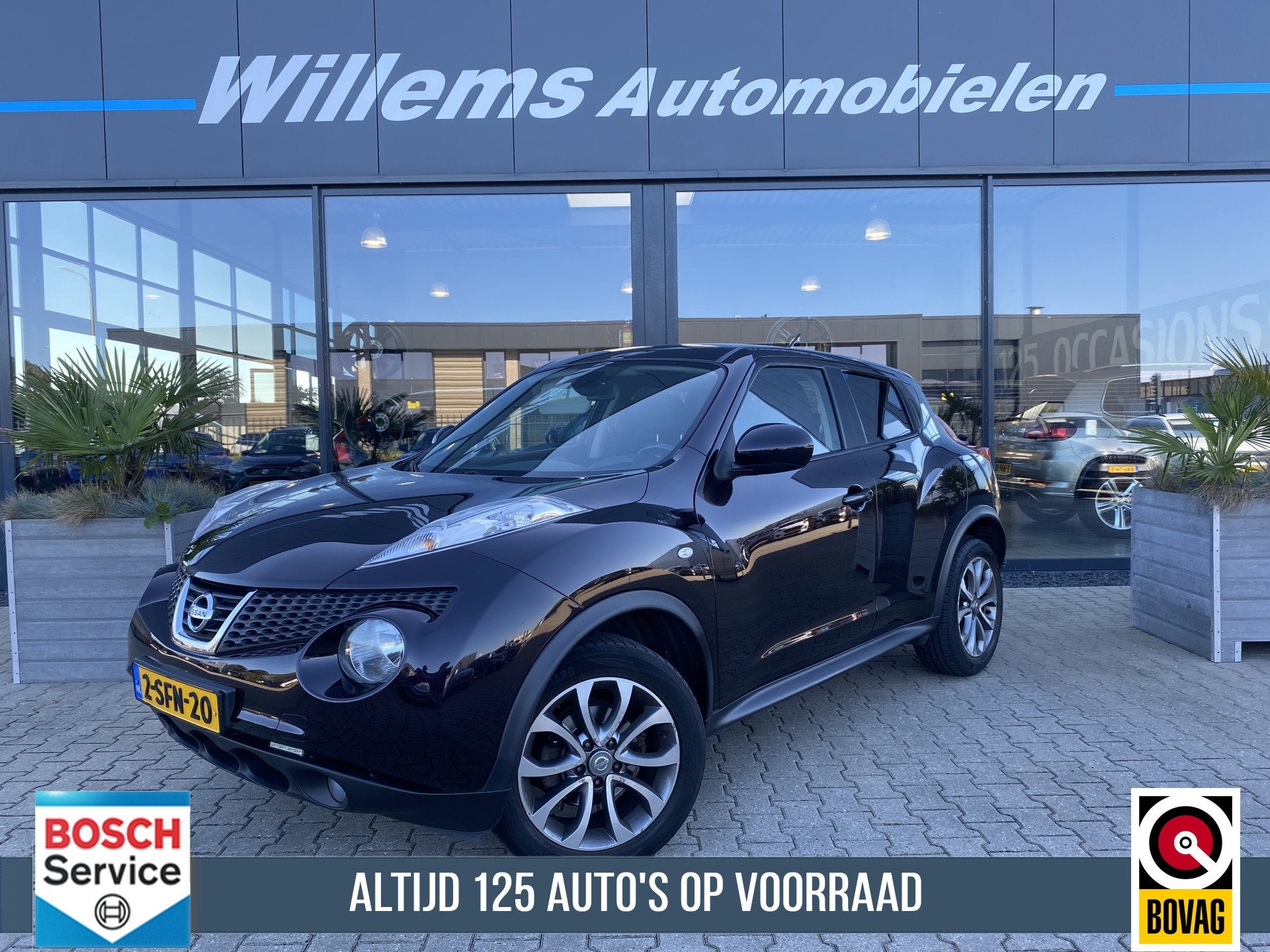 Nissan Juke 1.6 Tekna Cruise Control, Camera & Stoelverwarmi, Auto's, Euro 5, Zwart, 4 cilinders, Met garantie (alle)