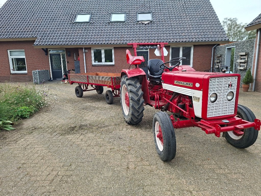 International 323 met platte kar., Gebruikt, McCormick, Ophalen of Verzenden, Tot 80 Pk