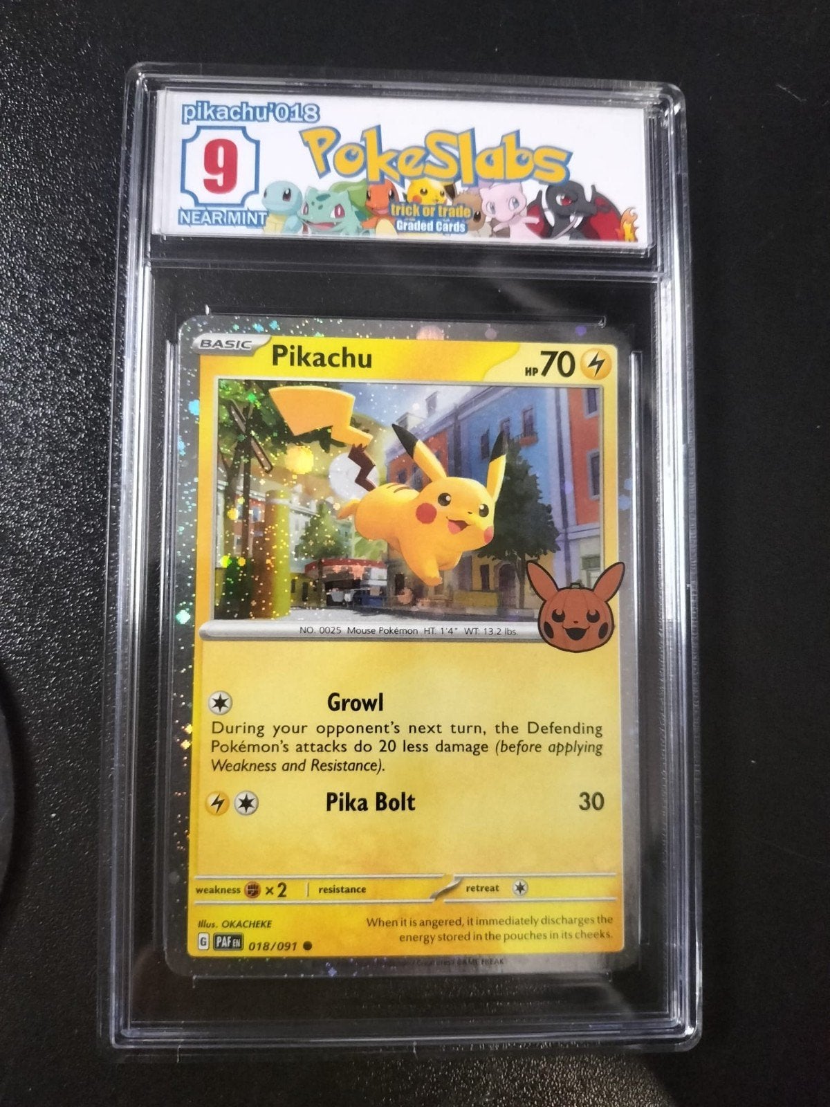 Pikachu 018/091 Trick or Trade Graded 9 Near Mint, Ophalen of Verzenden, Zo goed als nieuw, Losse kaart